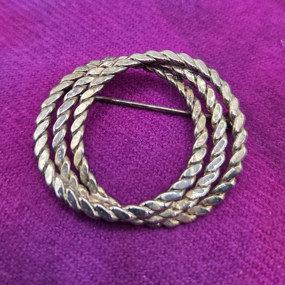 920. Silver-Tone Circle Brooch